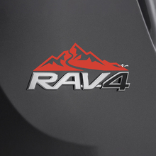 Etiqueta adhesiva de la casa de las montañas sobre la insignia trasera del Toyota Rav4
 2