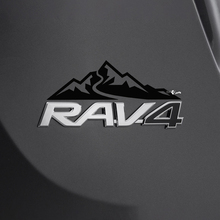 Etiqueta adhesiva de la casa de las montañas sobre la insignia trasera del Toyota Rav4
 3